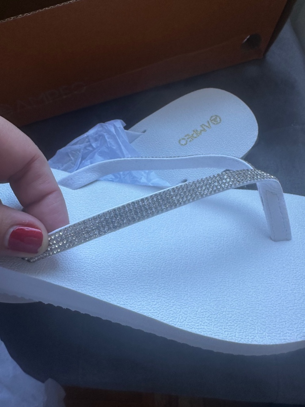 White flip-flops with rhinestone strap